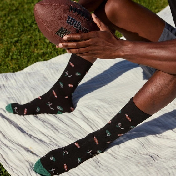 Socks that Support Youth Sports (Black Footballs)